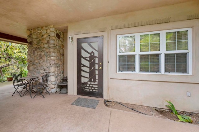 3161921 Via Puerta Del Sol, Bonsall, CA 92003 - doorway to property with stucco siding