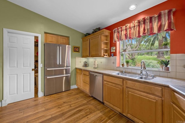 3161921 Via Puerta Del Sol, Bonsall, CA 92003 - kitchen featuring a sink, appliances with stainless steel finishes, lofted ceiling, and tasteful backsplash