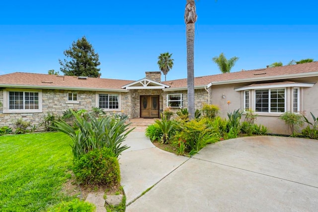 3161921 Via Puerta Del Sol, Bonsall, CA 92003 - ranch-style home with stucco siding, a chimney, a front lawn, and stone siding