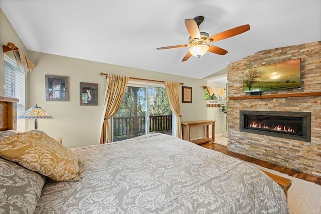 3161921 Via Puerta Del Sol, Bonsall, CA 92003 - bedroom featuring wood finished floors, a large fireplace, access to outside, ceiling fan, and lofted ceiling