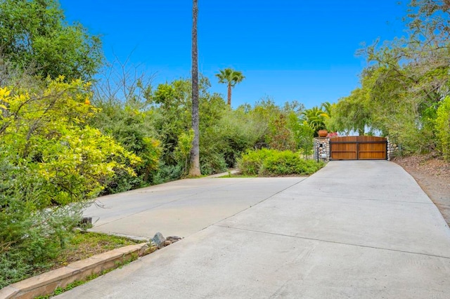 3161921 Via Puerta Del Sol, Bonsall, CA 92003 - exterior space with driveway, a gated entry, and a gate