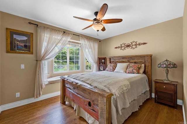 3161921 Via Puerta Del Sol, Bonsall, CA 92003 - bedroom featuring baseboards, wood finished floors, and a ceiling fan