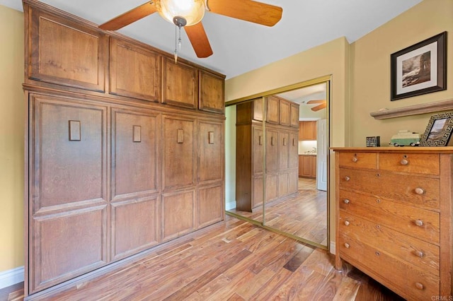 3161921 Via Puerta Del Sol, Bonsall, CA 92003 - bedroom featuring ceiling fan, baseboards, light wood finished floors, and a closet