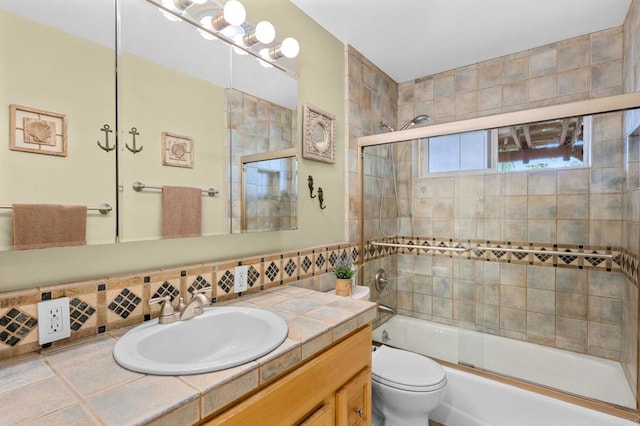 3161921 Via Puerta Del Sol, Bonsall, CA 92003 - bathroom with tasteful backsplash, shower / bath combination with glass door, toilet, and vanity