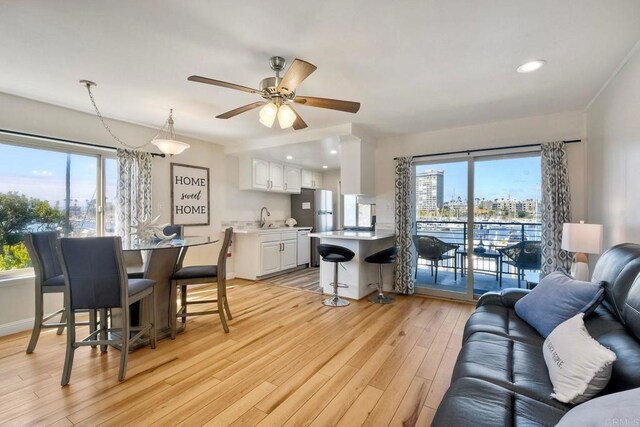 1202 N Pacific St Unit 201B, Oceanside, CA 92054 - living room with recessed lighting, ceiling fan, and light wood-type flooring