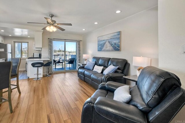 1202 N Pacific St Unit 201B, Oceanside, CA 92054 - living room with light wood-style floors, a ceiling fan, and recessed lighting