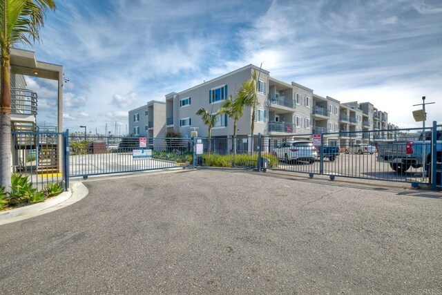 1202 N Pacific St Unit 201B, Oceanside, CA 92054 - view of road with a gate, a gated entry, and curbs