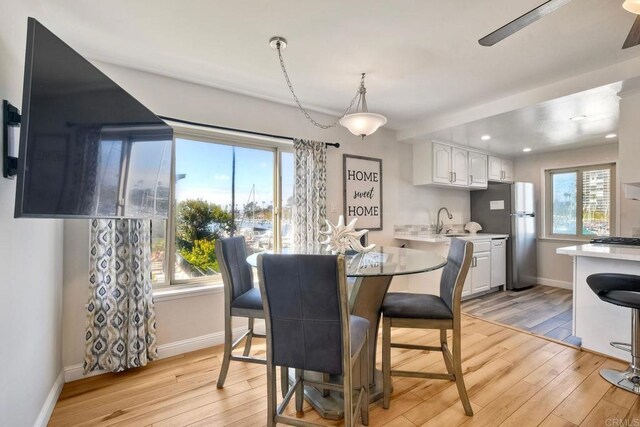 1202 N Pacific St Unit 201B, Oceanside, CA 92054 - dining space featuring light wood-style floors, baseboards, a ceiling fan, and recessed lighting