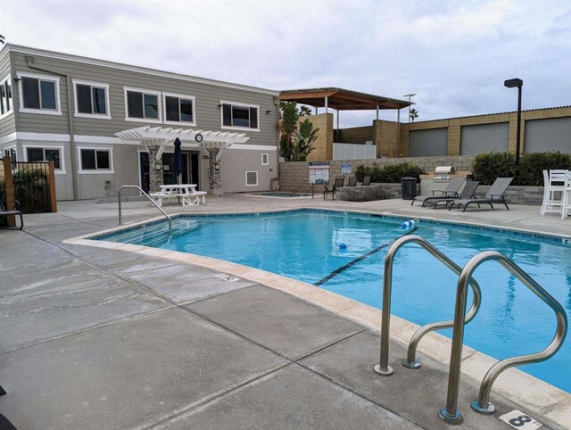 1202 N Pacific St Unit 201B, Oceanside, CA 92054 - pool with a pergola and a patio