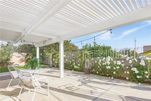 view of patio featuring fence