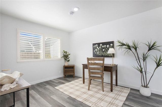 home office featuring wood finished floors and baseboards