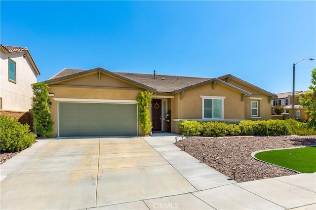single story home featuring a garage, stucco siding, and driveway