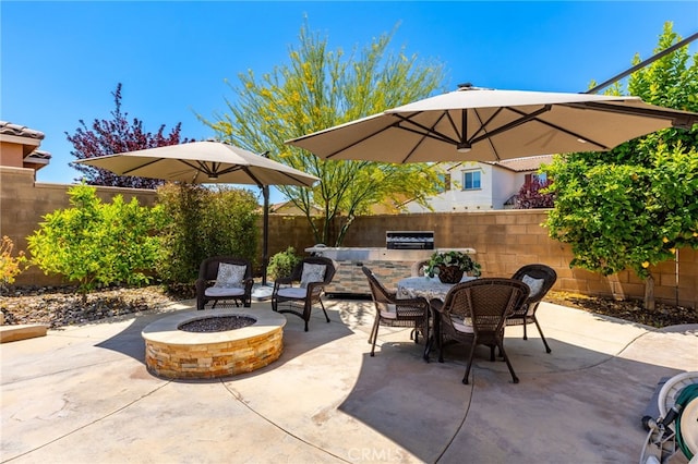 30525 Hawkscrest Rd, Murrieta, CA 92563 - view of patio / terrace featuring an outdoor fire pit, exterior kitchen, a fenced backyard, and outdoor dining space