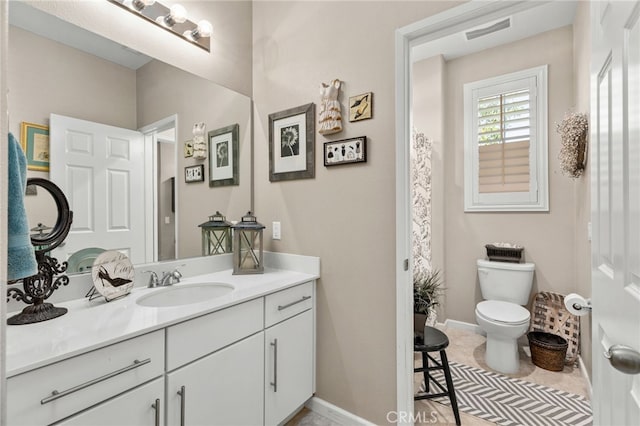 30525 Hawkscrest Rd, Murrieta, CA 92563 - bathroom featuring toilet, vanity, baseboards, and tile patterned floors