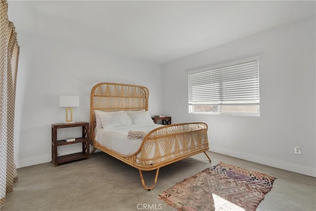 bedroom featuring baseboards