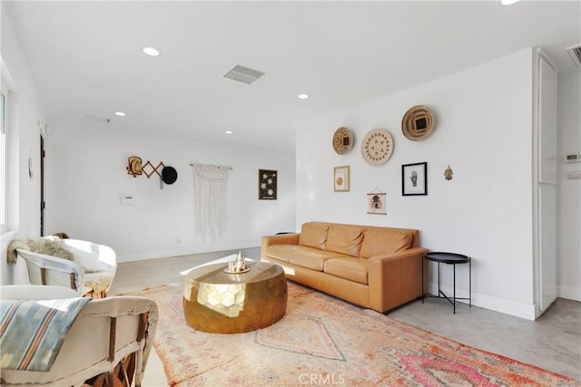living room with baseboards, recessed lighting, and visible vents