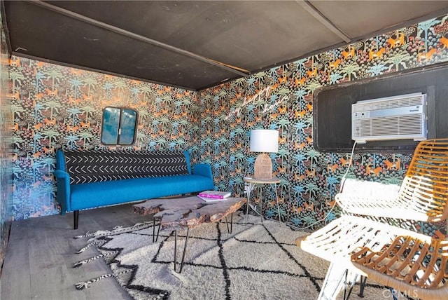 interior space with wallpapered walls, a wall unit AC, and carpet