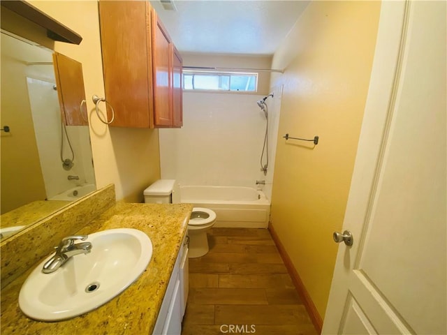 bathroom with vanity, shower / bathing tub combination, toilet, baseboards, and wood finished floors
