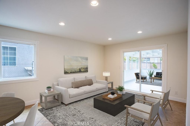 living area with baseboards, recessed lighting, and light tile patterned flooring