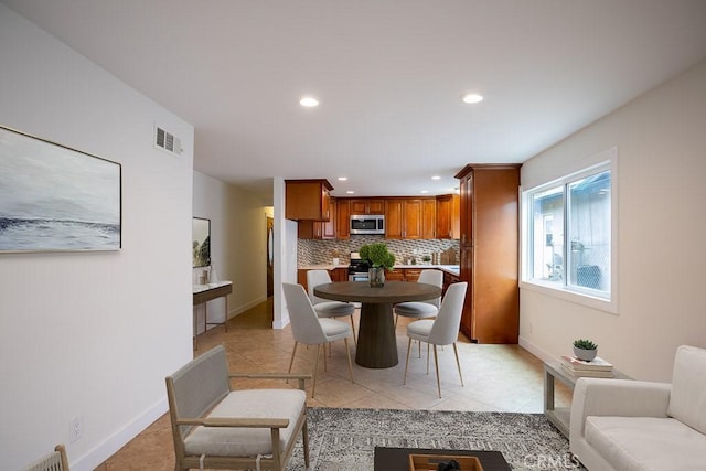 dining area featuring visible vents, recessed lighting, light tile patterned flooring, and baseboards