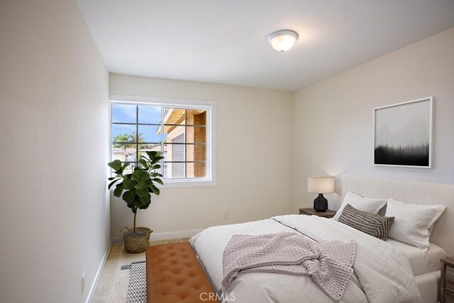 bedroom featuring baseboards