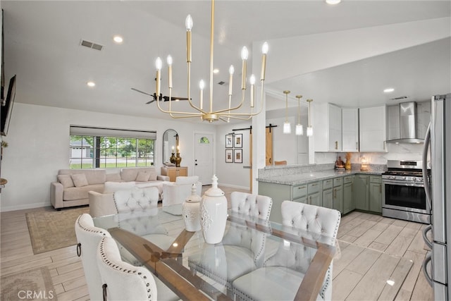 dining area featuring recessed lighting, a chandelier, wood tiled floor, visible vents, and baseboards