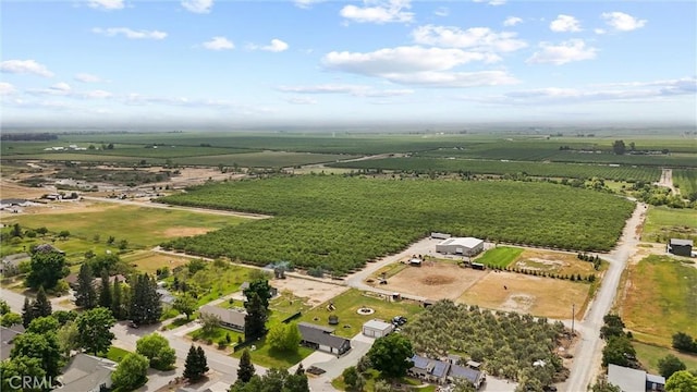 birds eye view of property with a rural view