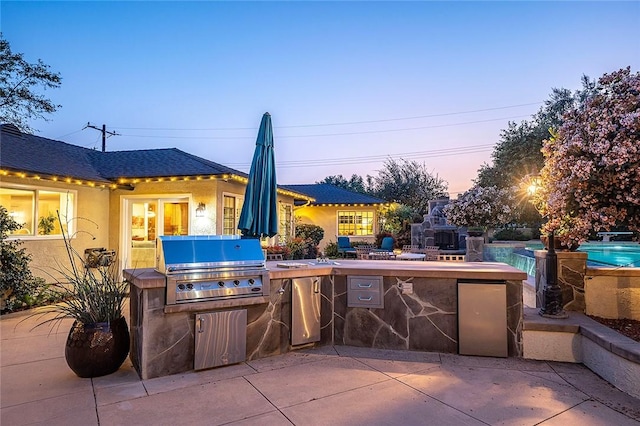 view of patio / terrace with area for grilling, an outdoor pool, and a grill