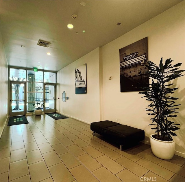 630 W 6th St Unit 611, Los Angeles, CA 90017 - lobby featuring a wall of windows and recessed lighting
