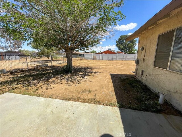 18225 Casaba Rd, Adelanto, CA 92301 - view of yard featuring fence and a patio area
