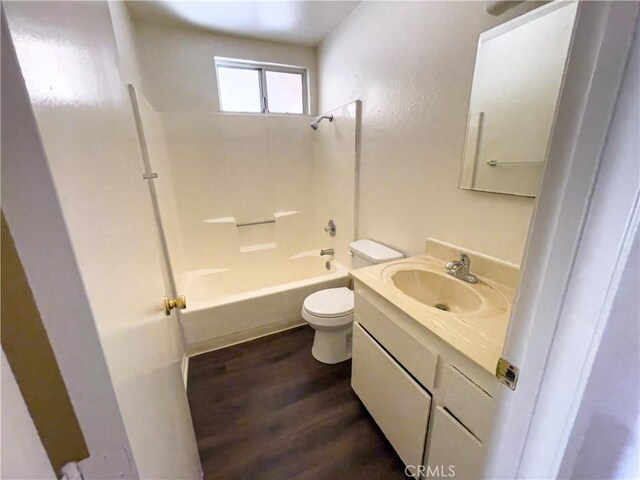18225 Casaba Rd, Adelanto, CA 92301 - bathroom with shower / bathtub combination, toilet, wood finished floors, and vanity