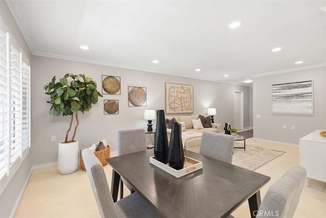 dining space with recessed lighting, ornamental molding, baseboards, and light carpet