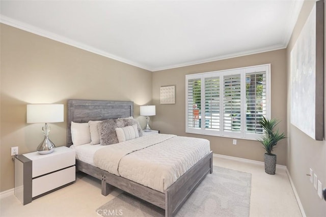 carpeted bedroom with crown molding and baseboards