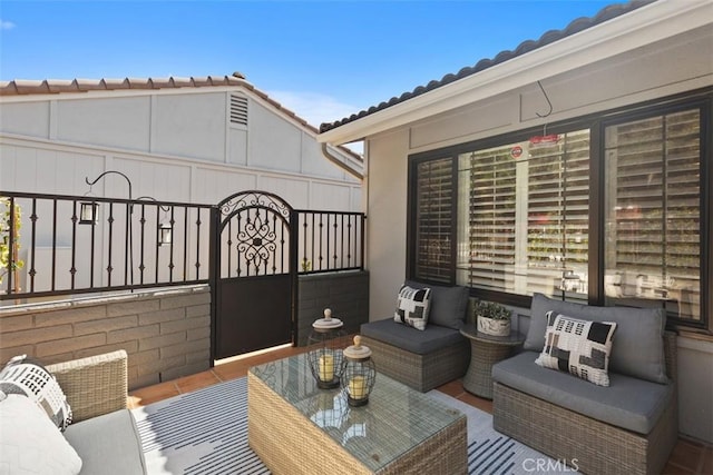 view of patio / terrace featuring fence and an outdoor hangout area