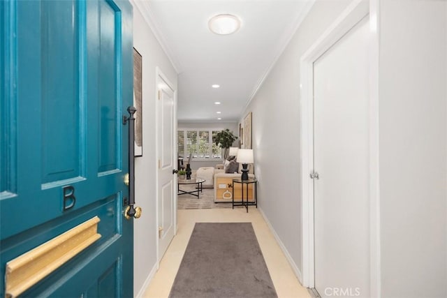entryway featuring recessed lighting, baseboards, and ornamental molding