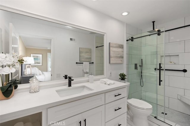 full bath featuring visible vents, vanity, toilet, recessed lighting, and a shower stall