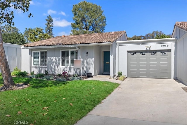 ranch-style house with an attached garage, driveway, a tile roof, and a front yard