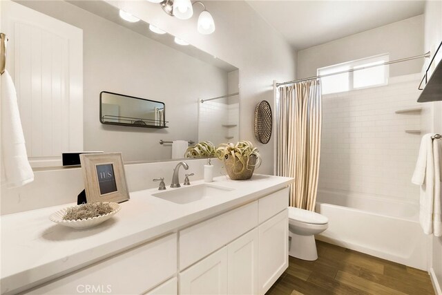 2617 Sedona Ave, Chico, CA 95973 - bathroom featuring wood finished floors, toilet, vanity, and shower / bath combination with curtain
