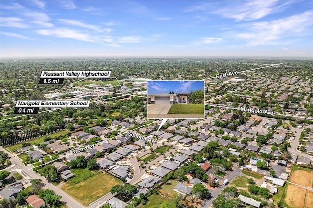 birds eye view of property with a residential view