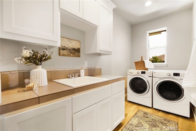 2617 Sedona Ave, Chico, CA 95973 - laundry area with washing machine and clothes dryer, cabinet space, light wood-style floors, and recessed lighting