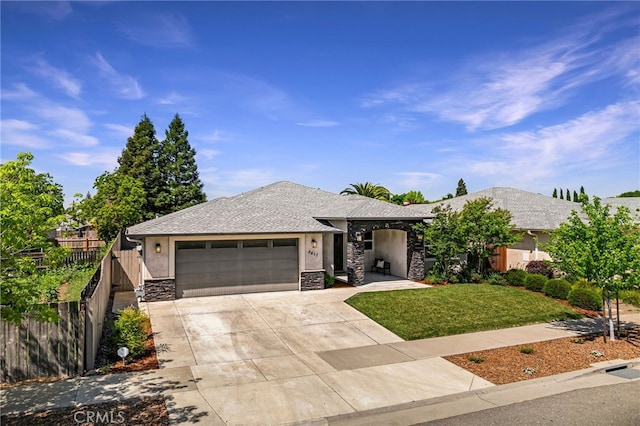 view of front of property featuring a garage, fence, concrete driveway, and stone siding