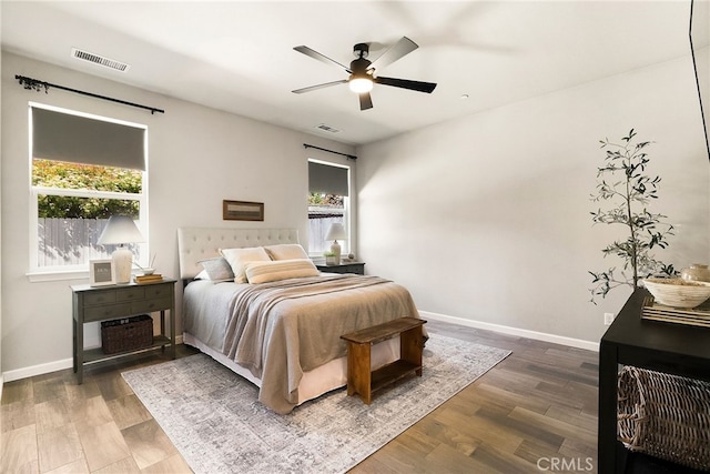 2617 Sedona Ave, Chico, CA 95973 - bedroom with multiple windows, baseboards, a ceiling fan, and wood finished floors