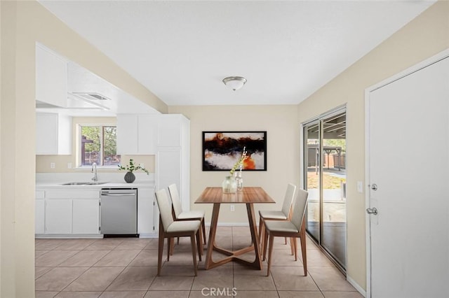 dining room with light tile patterned floors and visible vents
