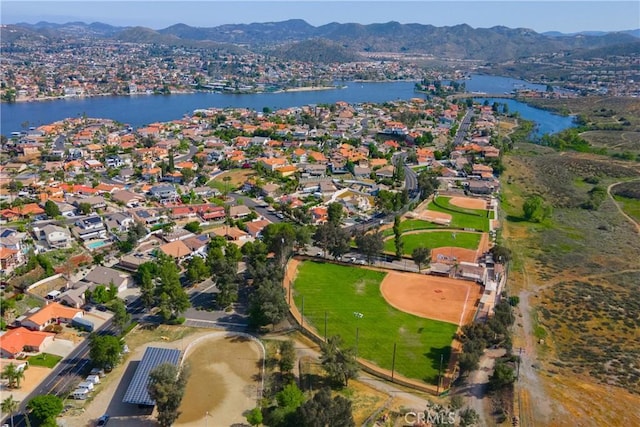 bird's eye view with a water and mountain view and a residential view