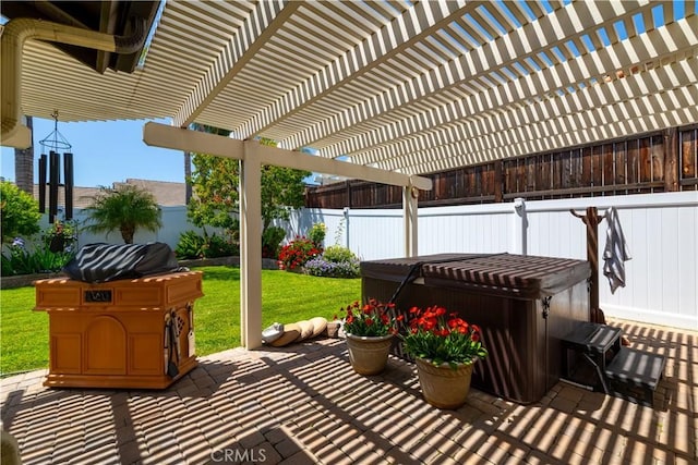 view of patio with a hot tub, a pergola, and a fenced backyard