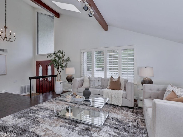 living room featuring an inviting chandelier, beam ceiling, high vaulted ceiling, visible vents, and a skylight