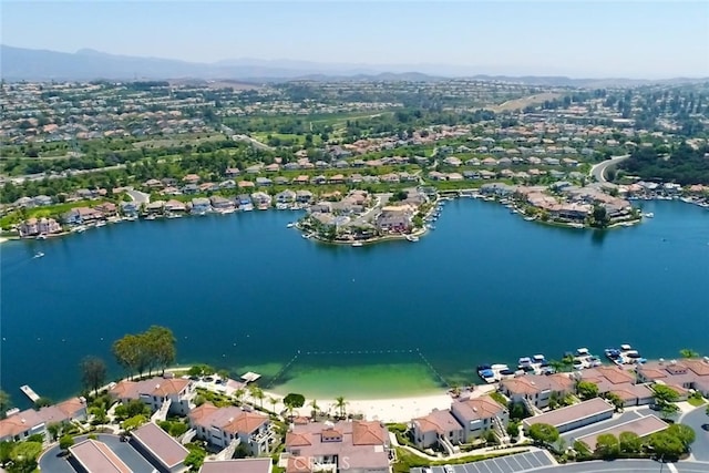 bird's eye view featuring a residential view and a water and mountain view