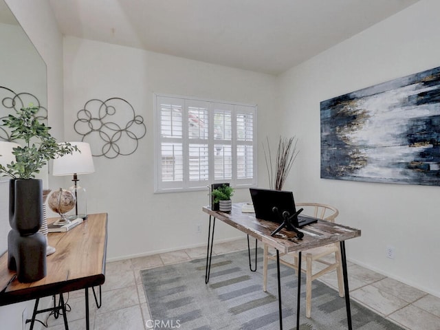 home office with baseboards and light tile patterned flooring