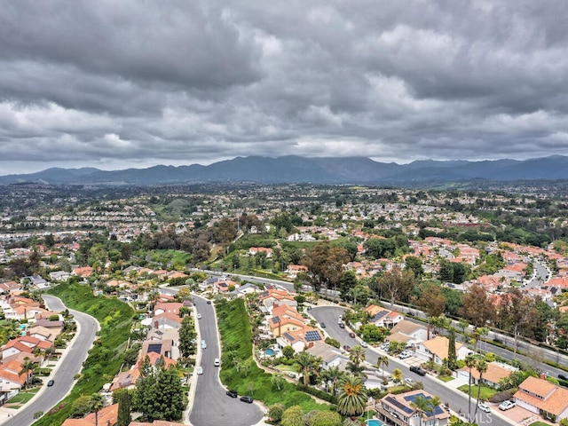 birds eye view of property with a mountain view and a residential view