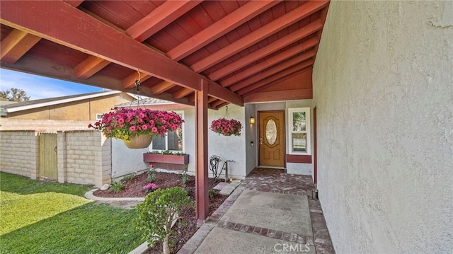 entrance to property featuring stucco siding